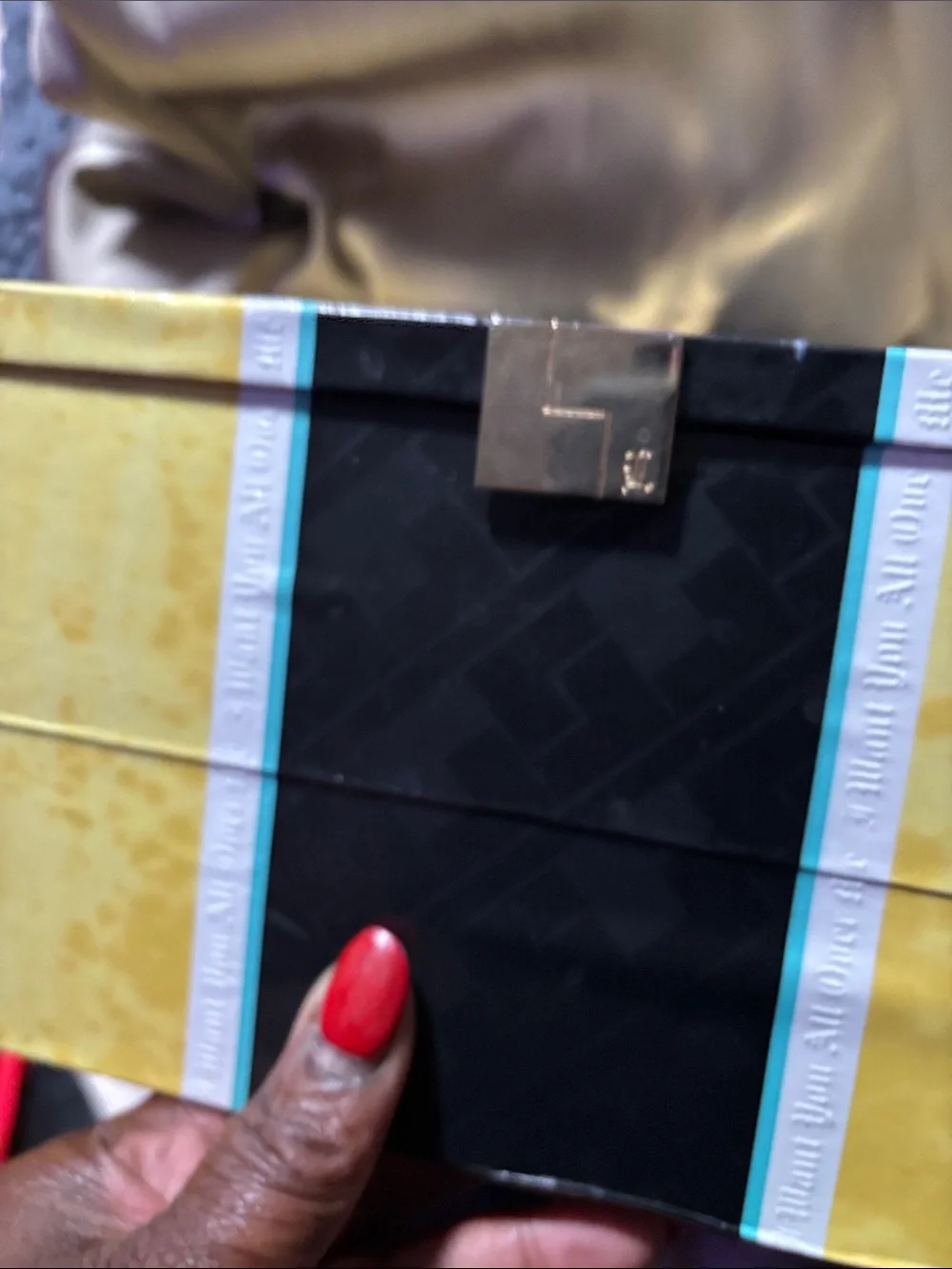 Cartier red and gold jewelry box with decorative trim/L.A.M.B fr by Gwen Stefani